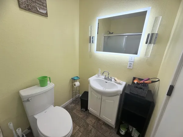 a bathroom with a sink and toilet