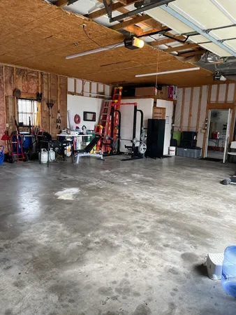 a view of a garage with parked cars
