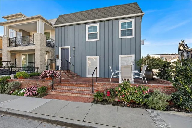 front view of a house with potted plants