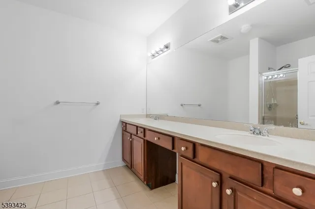 a room with a sink and a mirror