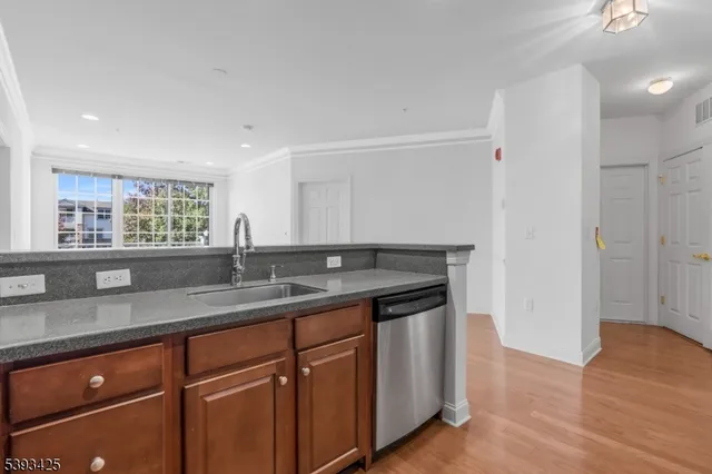 a kitchen with a sink and cabinets
