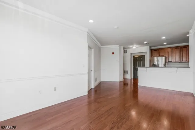 a view of a kitchen with wooden floor