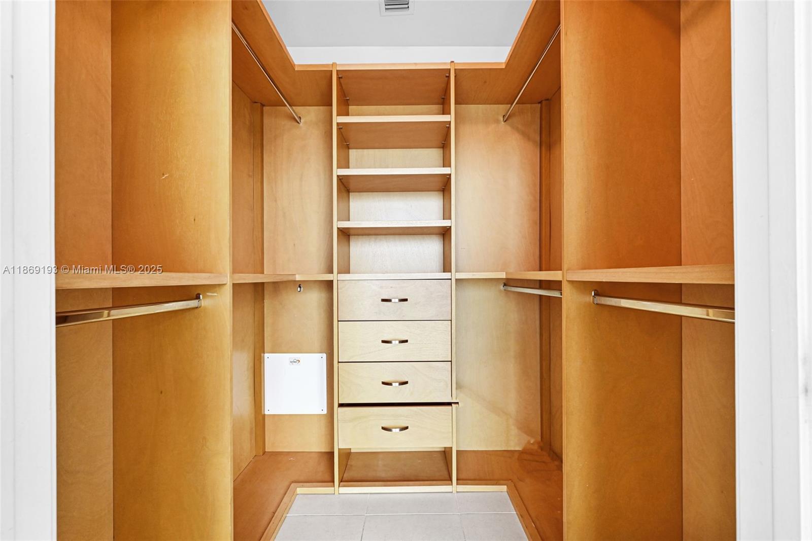 888 Biscayne Boulevard, Unit 5010 Miami, FL 33132 - Photo 7 of 18 a view of walk in closet with empty racks