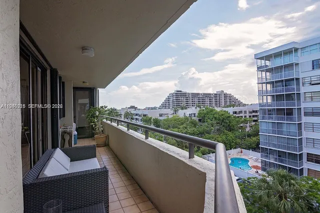 a view of balcony with furniture