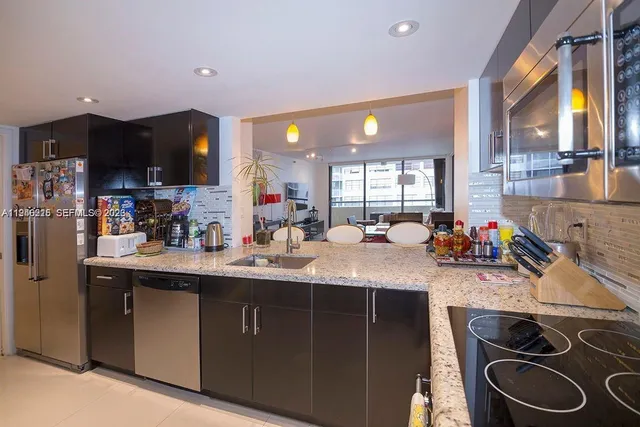 a kitchen with lots of counter top space and a sink