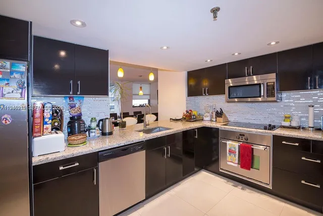 a kitchen with lots of counter top space and a sink
