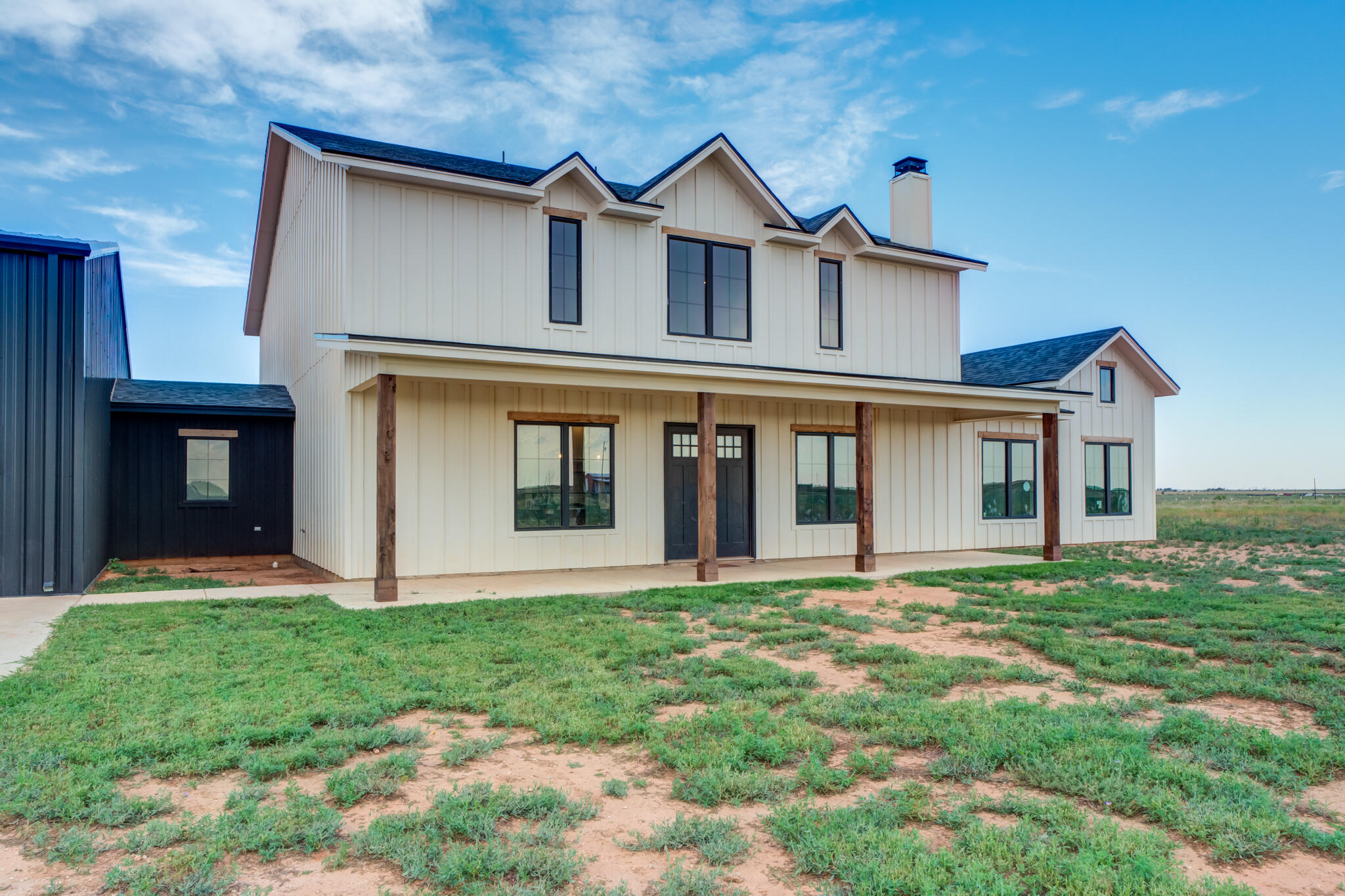 1735 Lovebird Road Lubbock, TX 79407 - Photo 2 of 44 a front view of a house with a yard