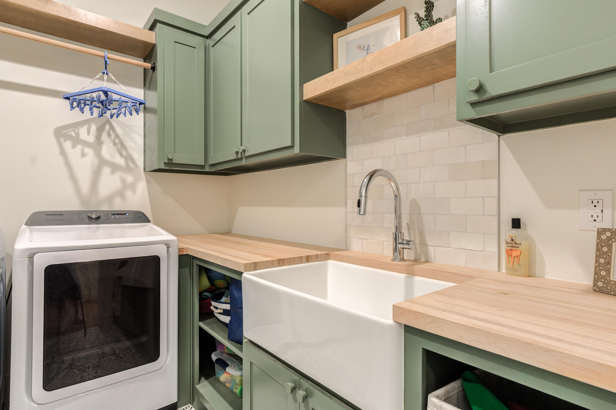 1735 Lovebird Road Lubbock, TX 79407 - Photo 24 of 44 a view of a kitchen with a sink and washing machine