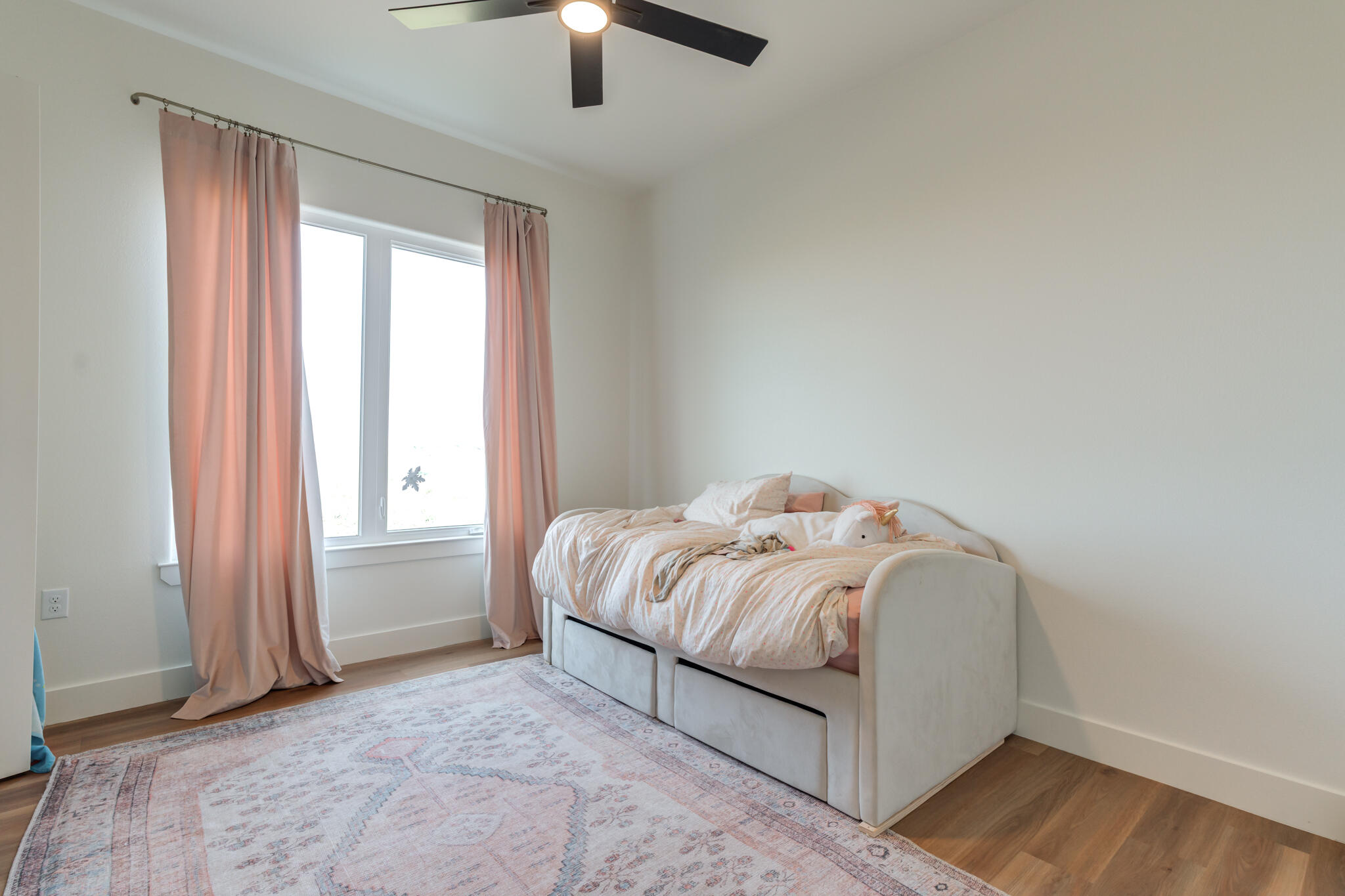 1735 Lovebird Road Lubbock, TX 79407 - Photo 29 of 44 a bedroom with a bed and a chandelier