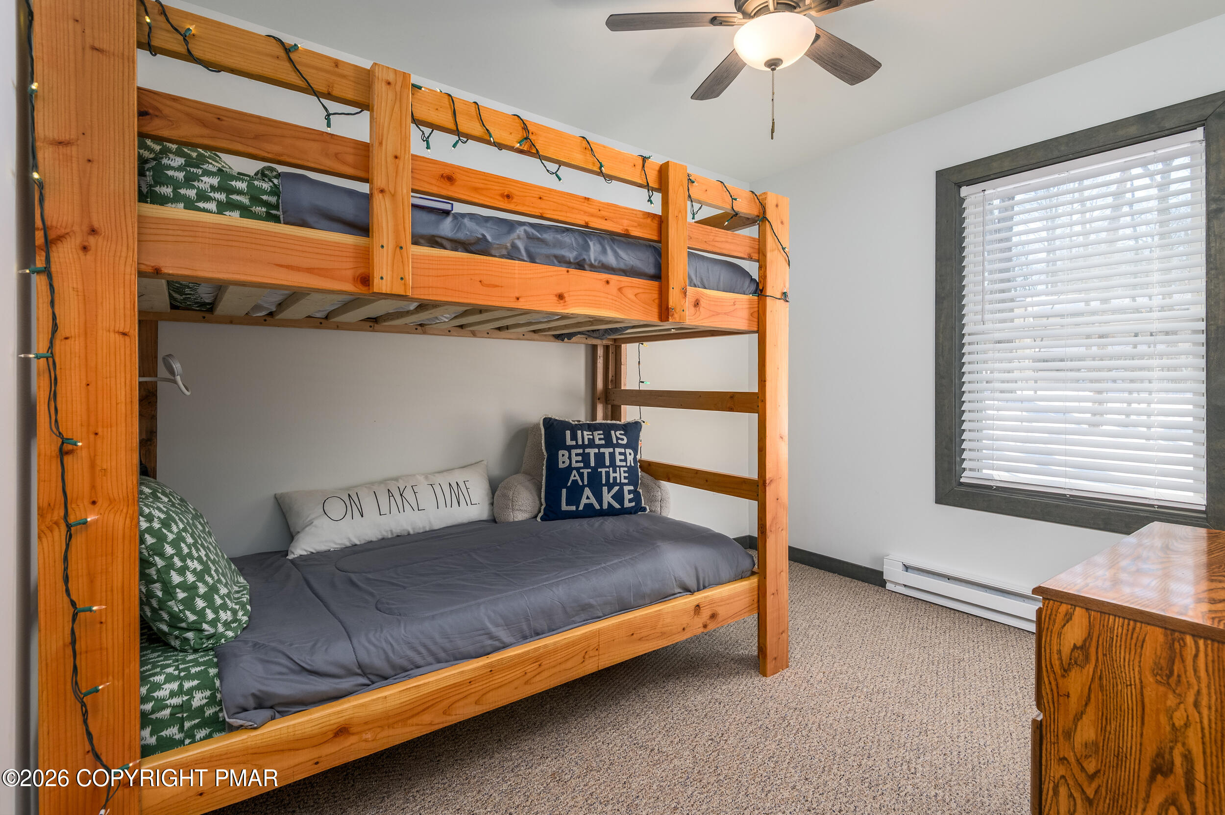 1819 Stag Run Pocono Lake, PA 18347 - Photo 14 of 40 a bedroom with a bed and a chandelier