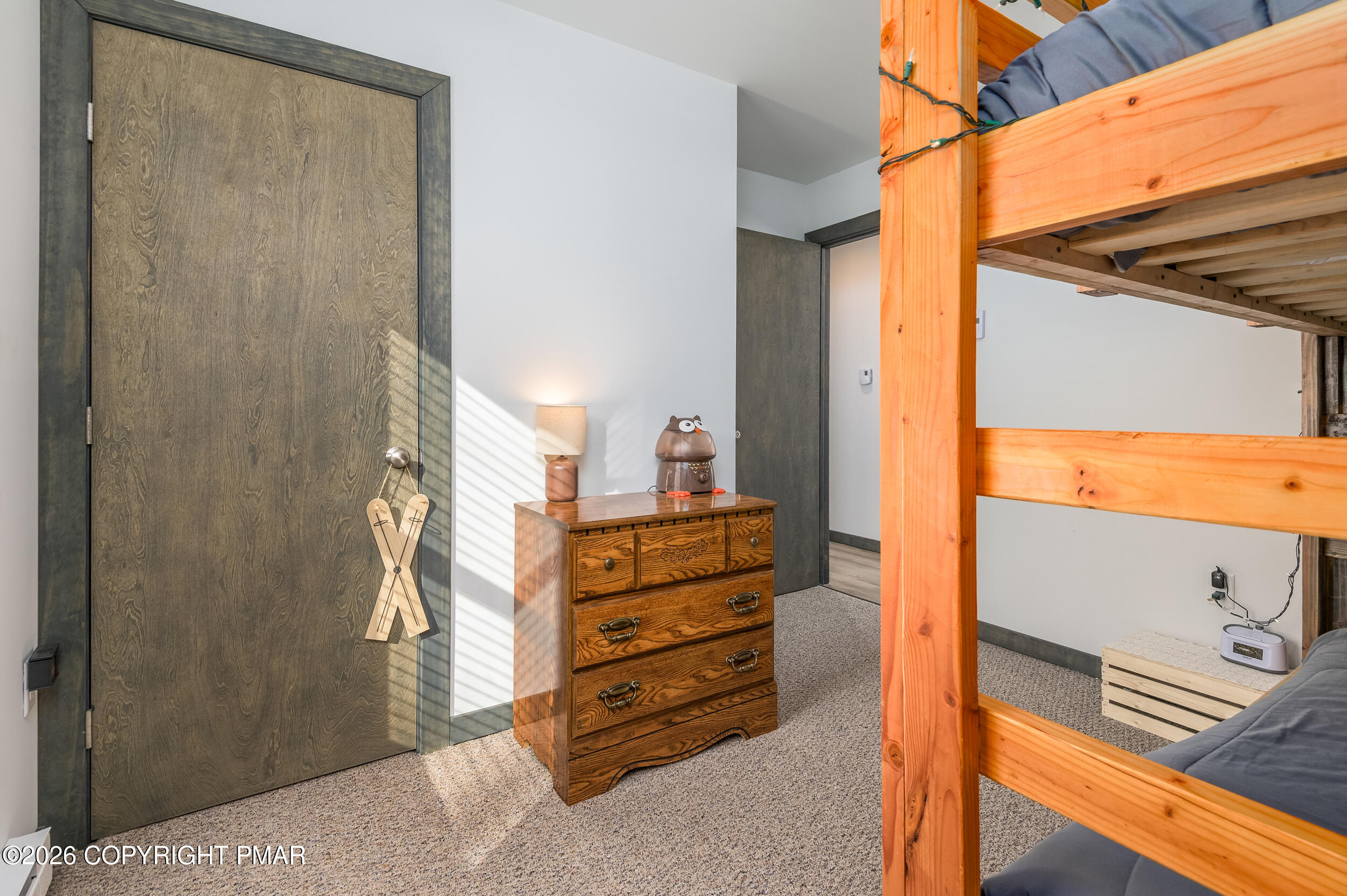1819 Stag Run Pocono Lake, PA 18347 - Photo 15 of 40 a view of a bedroom with furniture and a window