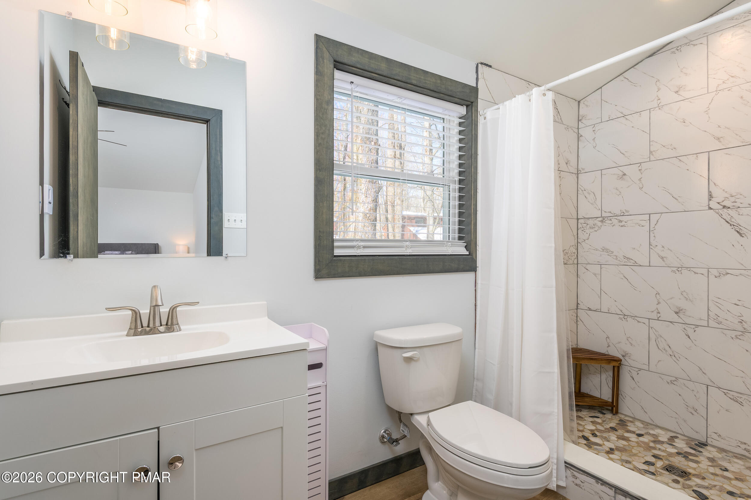 1819 Stag Run Pocono Lake, PA 18347 - Photo 22 of 40 a bathroom with a toilet a sink a shower and a mirror