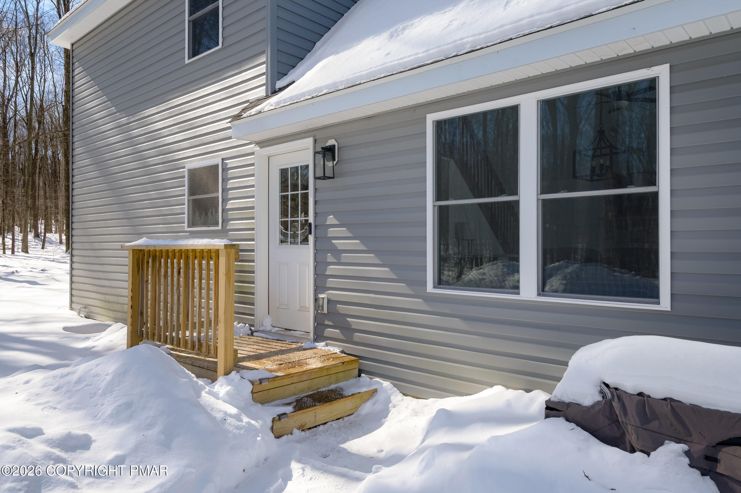 1819 Stag Run Pocono Lake, PA 18347 - Photo 25 of 40 a view of a house with a bed and wooden floor