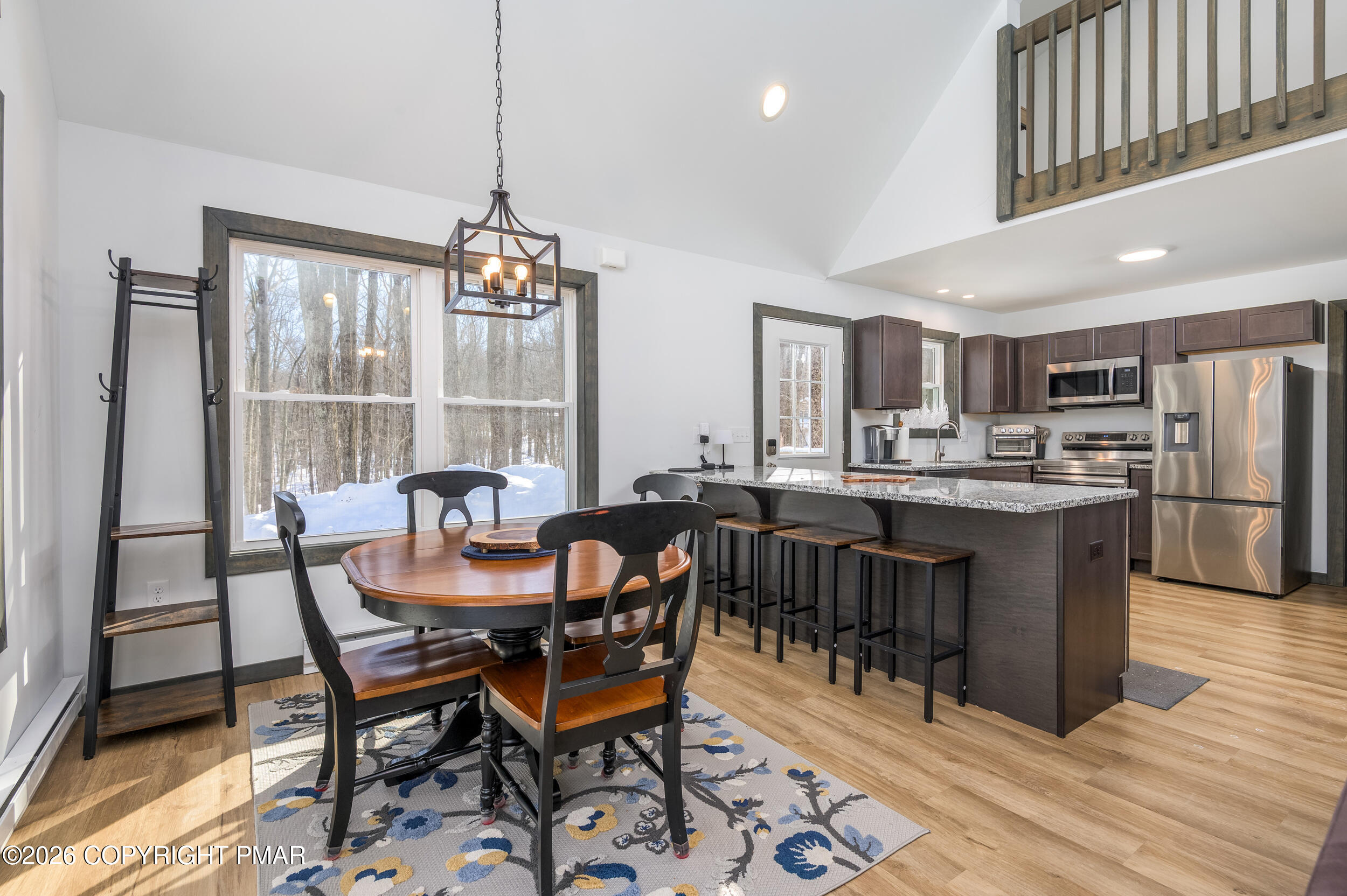 1819 Stag Run Pocono Lake, PA 18347 - Photo 7 of 40 a view of a dining room with furniture window and wooden floor