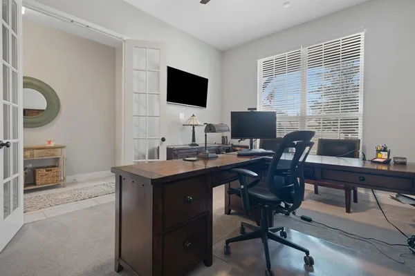 a view of a workspace with furniture