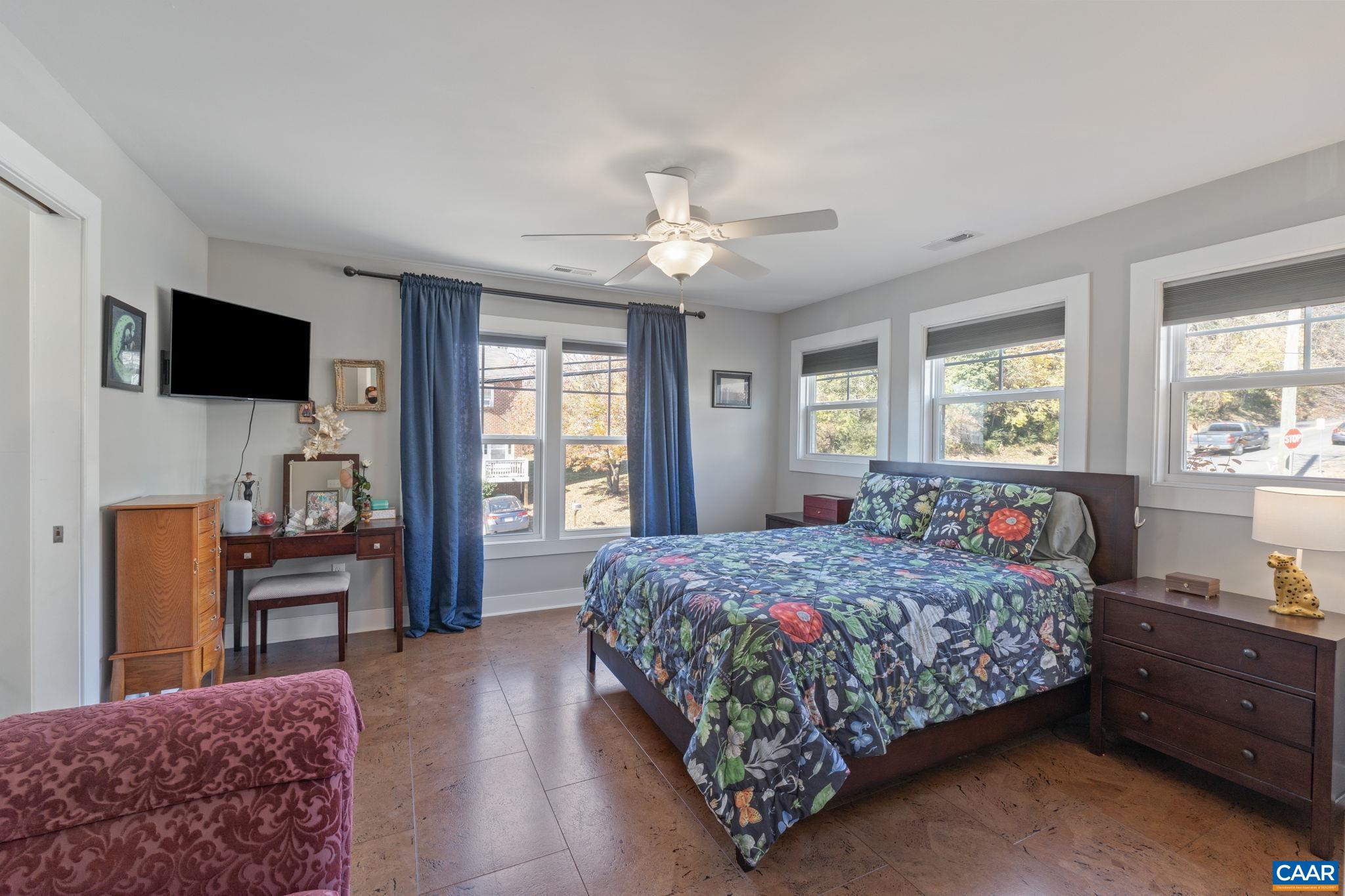 1450 Avon Street Charlottesville, VA 22902 - Photo 12 of 25 a bedroom with a bed and a flat screen tv