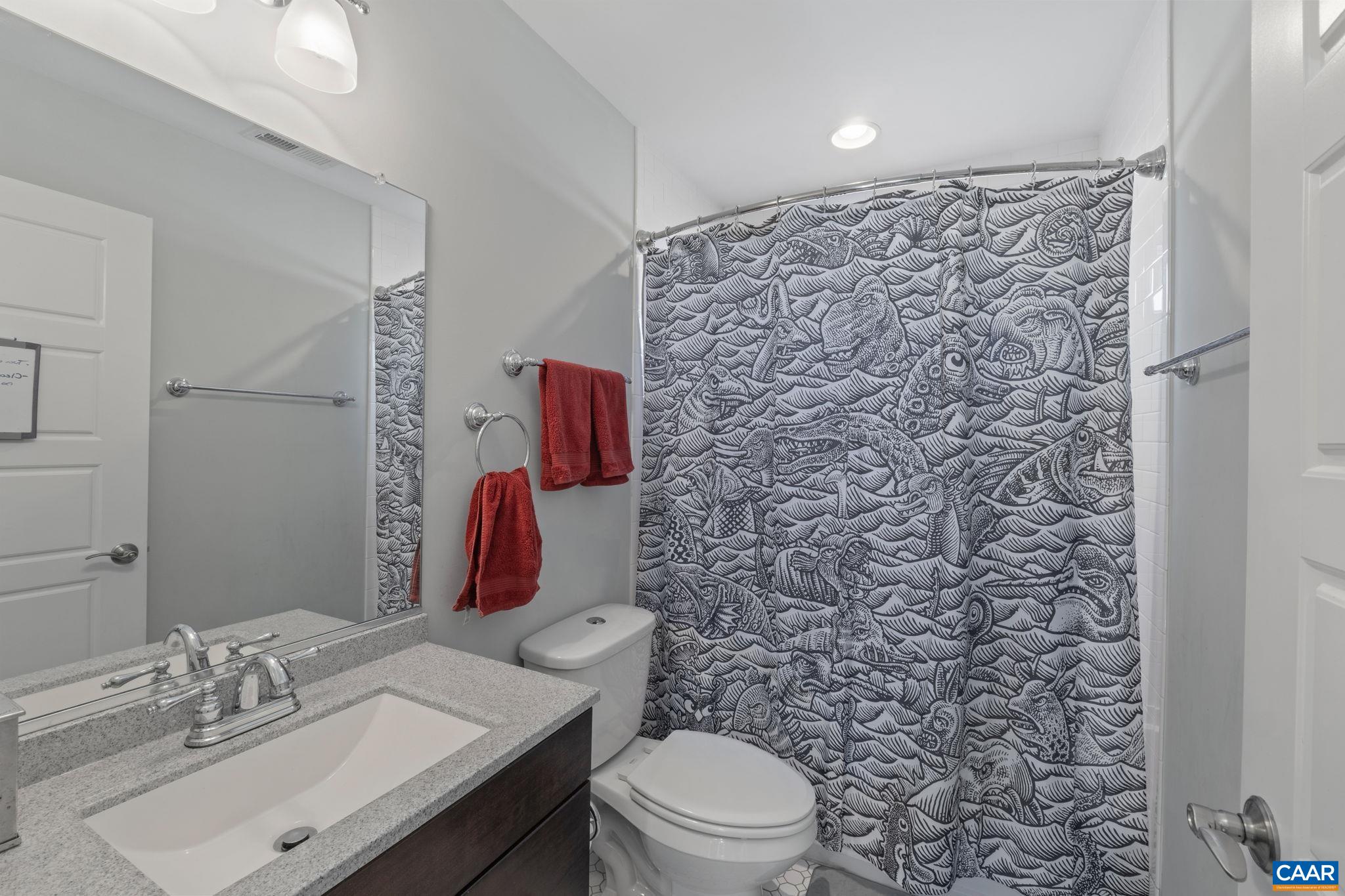 1450 Avon Street Charlottesville, VA 22902 - Photo 19 of 25 a bathroom with a sink toilet and shower