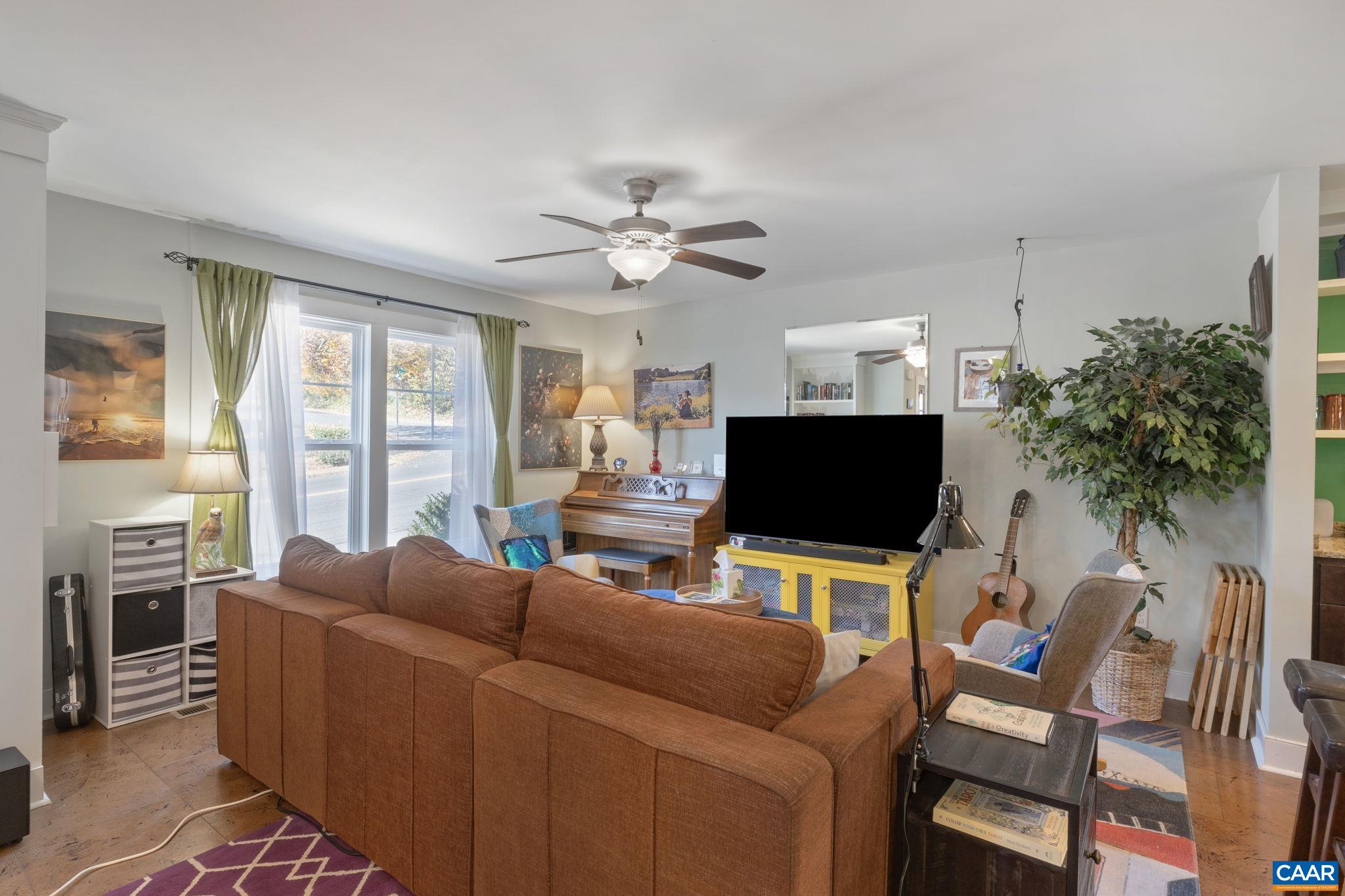 1450 Avon Street Charlottesville, VA 22902 - Photo 6 of 25 a living room with furniture and a flat screen tv
