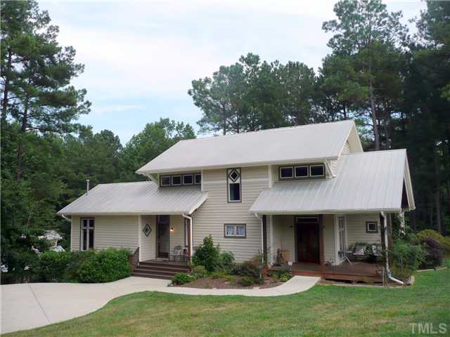 13320 Melvin Arnold Road Raleigh, NC 27613 - Photo 1 of 25 a view of a yard in front of house