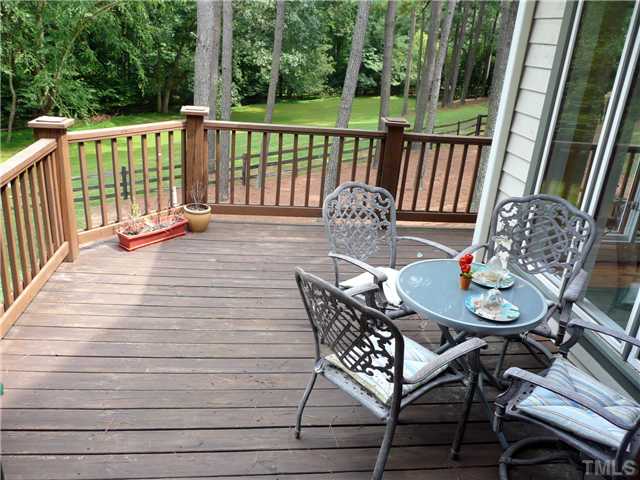 13320 Melvin Arnold Road Raleigh, NC 27613 - Photo 16 of 25 a view of a chairs and table on the deck