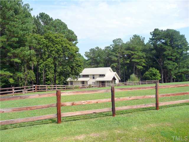 13320 Melvin Arnold Road Raleigh, NC 27613 - Photo 25 of 25 a view of a green yard with large trees