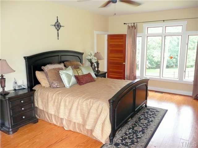 13320 Melvin Arnold Road Raleigh, NC 27613 - Photo 6 of 25 a bedroom with a bed and a window