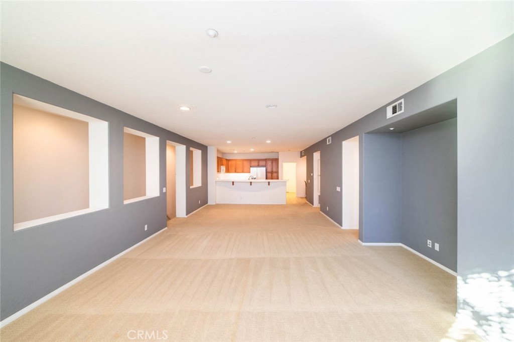 368 Quail Ridge Irvine, CA 92603 - Photo 3 of 23 a view of empty room with wooden floor and fan