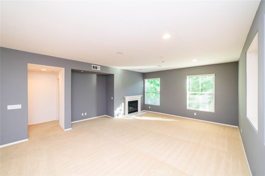 368 Quail Ridge Irvine, CA 92603 - Photo 4 of 23 a view of an empty room with window and fire place