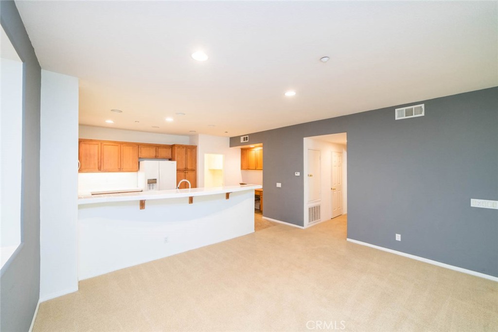 368 Quail Ridge Irvine, CA 92603 - Photo 5 of 23 a view of a kitchen with a sink and dishwasher a refrigerator with wooden floor