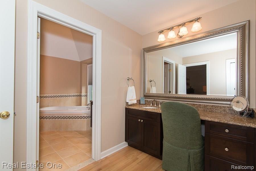 6376 Peach Tree Court Rochester, MI 48306 - Photo 14 of 27 DRESSING Area in the Master Suite with One of the Two Walk-in Closets (there's an additional double closet; that's right . . . 3 closets!).