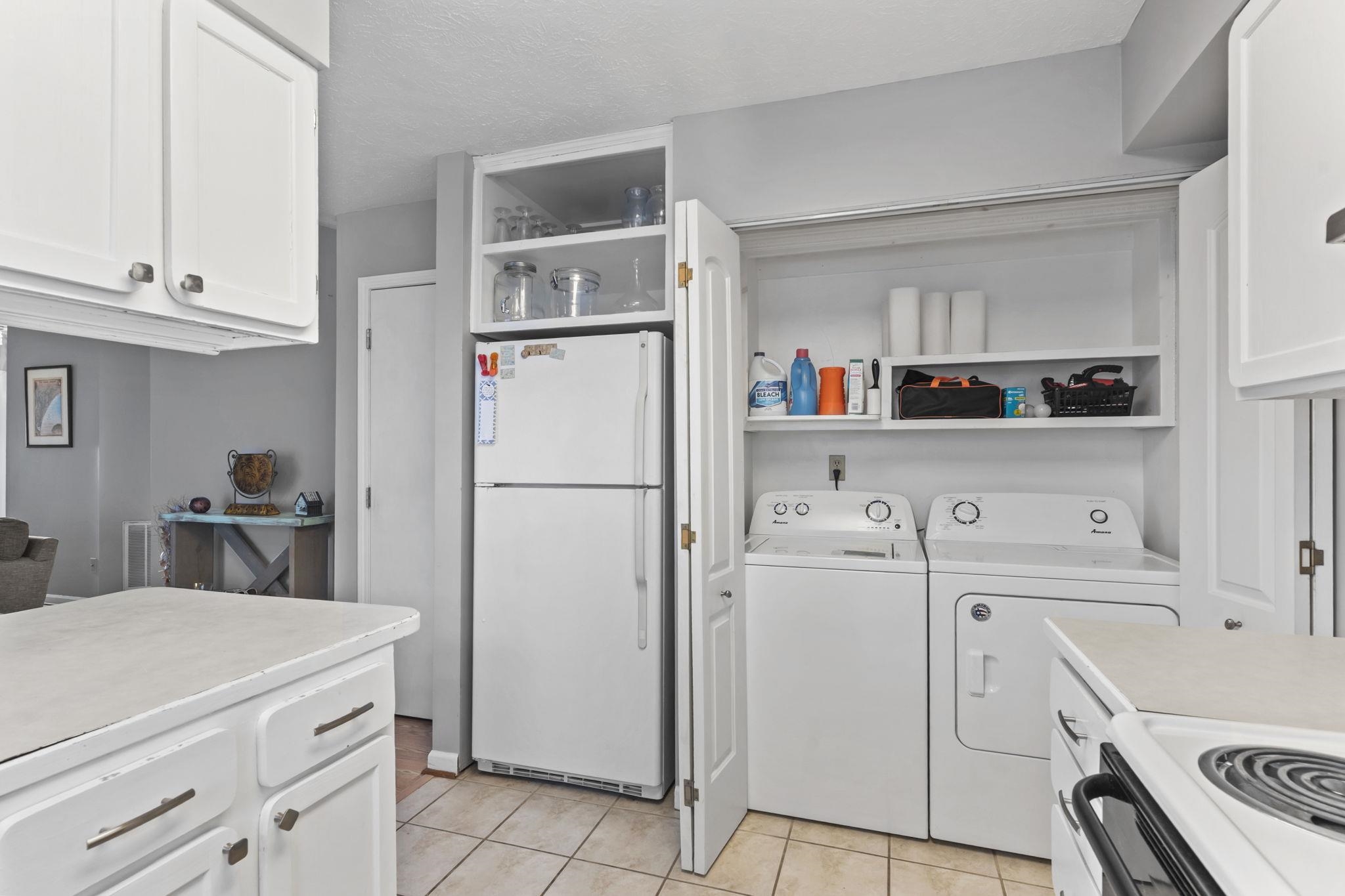 811 9th Avenue South North Myrtle Beach, SC 29582 - Photo 15 of 35 Kitchen featuring white cabinetry, white appliances, light countertops, open shelves, and a textured ceiling