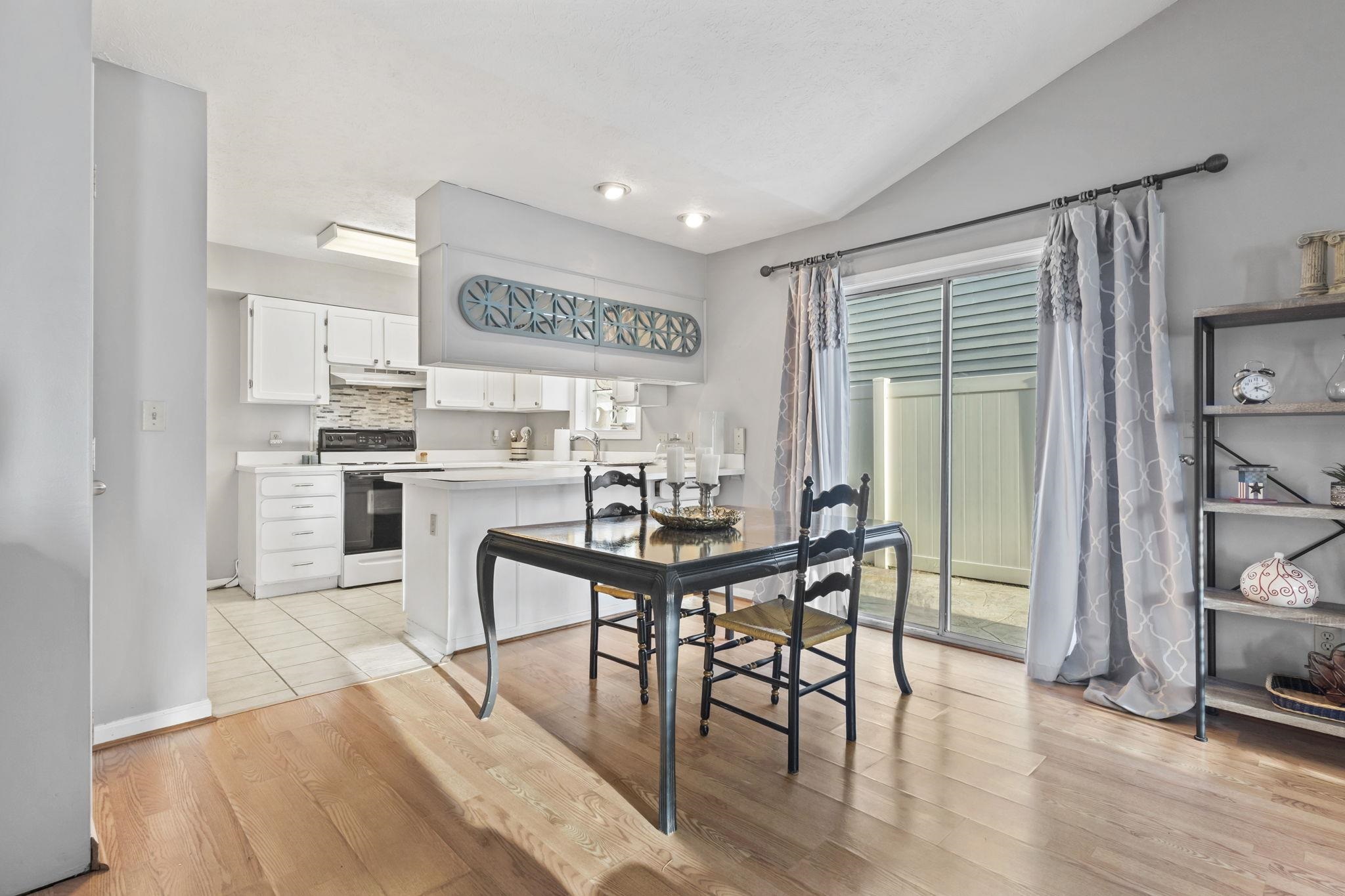 811 9th Avenue South North Myrtle Beach, SC 29582 - Photo 16 of 35 Dining area featuring light wood-style floors and lofted ceiling