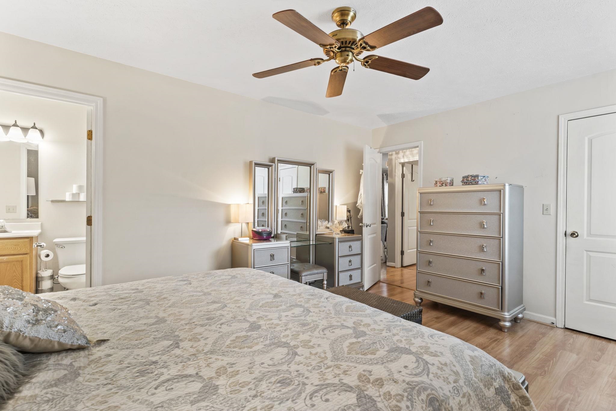 811 9th Avenue South North Myrtle Beach, SC 29582 - Photo 22 of 35 Bedroom featuring light wood-style floors, ceiling fan, and connected bathroom