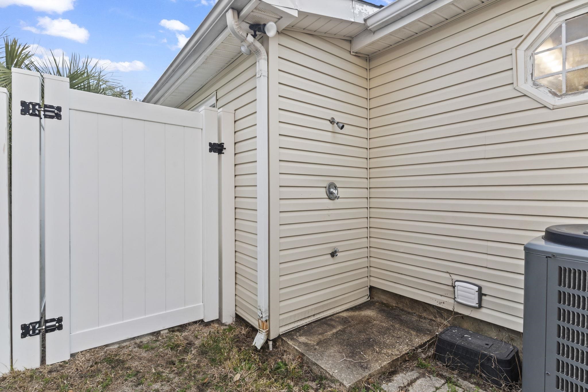 811 9th Avenue South North Myrtle Beach, SC 29582 - Photo 27 of 35 View of side of home with a cooling unit and a gate