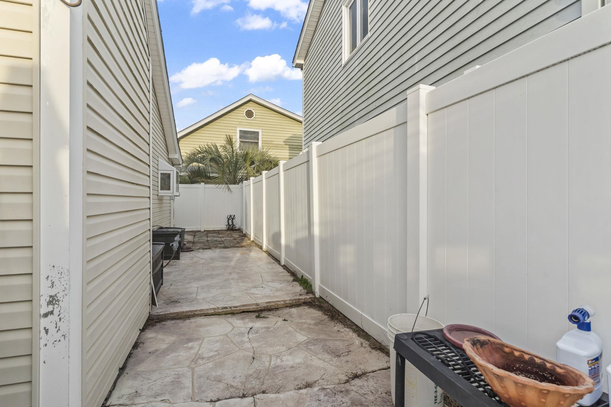 811 9th Avenue South North Myrtle Beach, SC 29582 - Photo 29 of 35 Fenced backyard featuring a patio