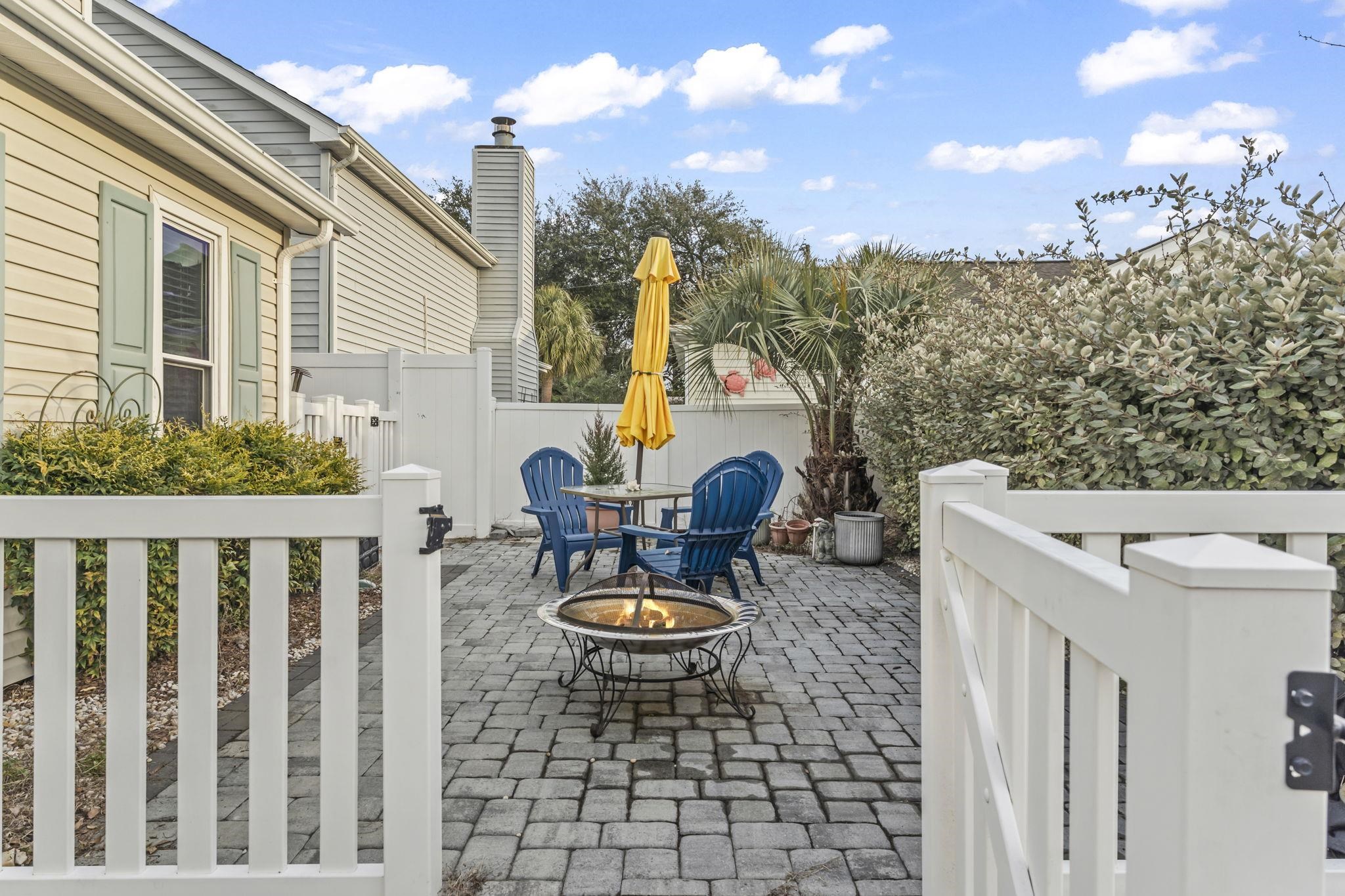 811 9th Avenue South North Myrtle Beach, SC 29582 - Photo 3 of 35 View of patio / terrace with a fire pit and outdoor dining space