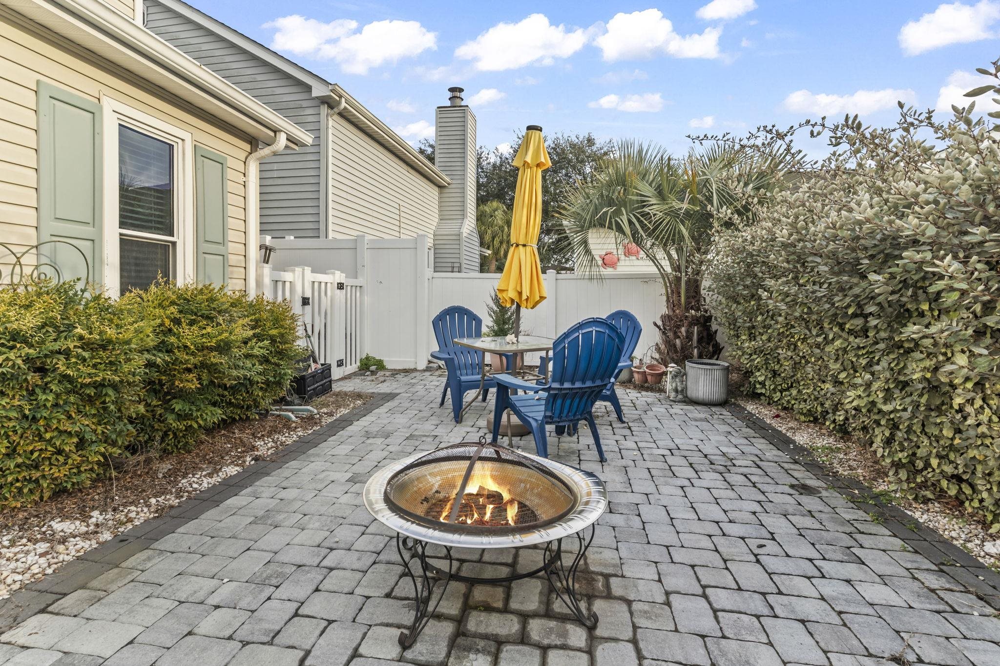 811 9th Avenue South North Myrtle Beach, SC 29582 - Photo 4 of 35 View of patio with a fire pit and outdoor dining area