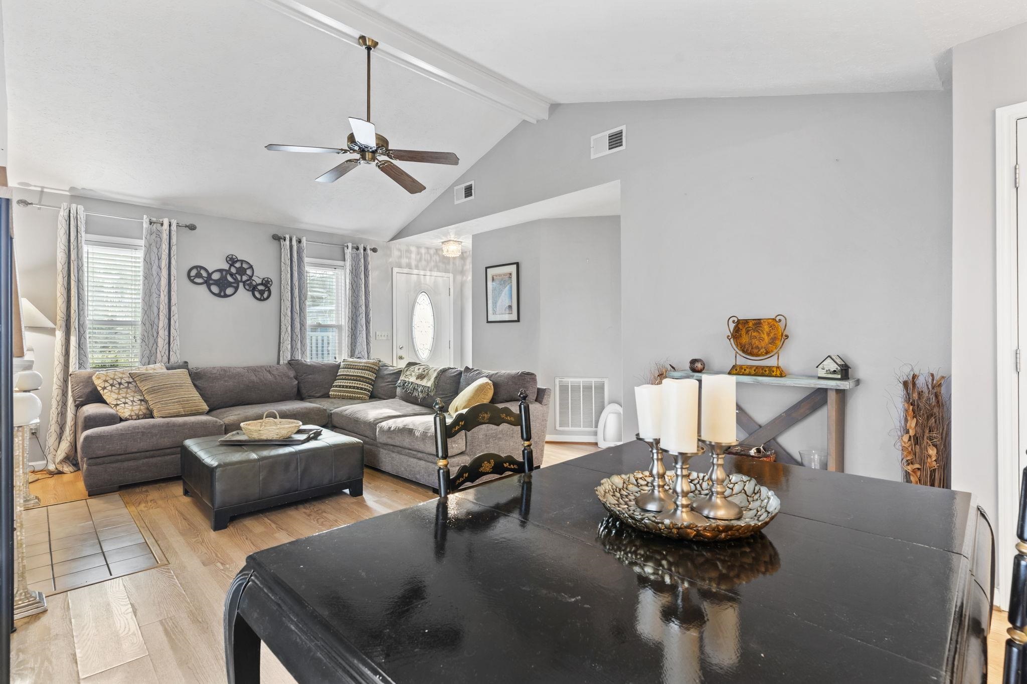 811 9th Avenue South North Myrtle Beach, SC 29582 - Photo 7 of 35 Living room featuring light wood-style flooring, beam ceiling, ceiling fan, and high vaulted ceiling