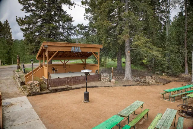 a backyard of a house with barbeque oven