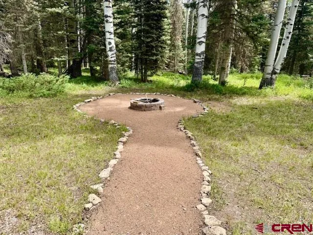 a view of a street with trees on both side of it