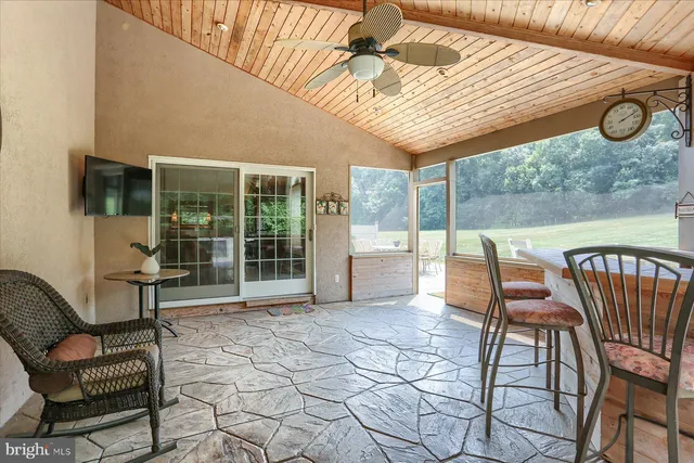 a view of a chairs and table in the patio
