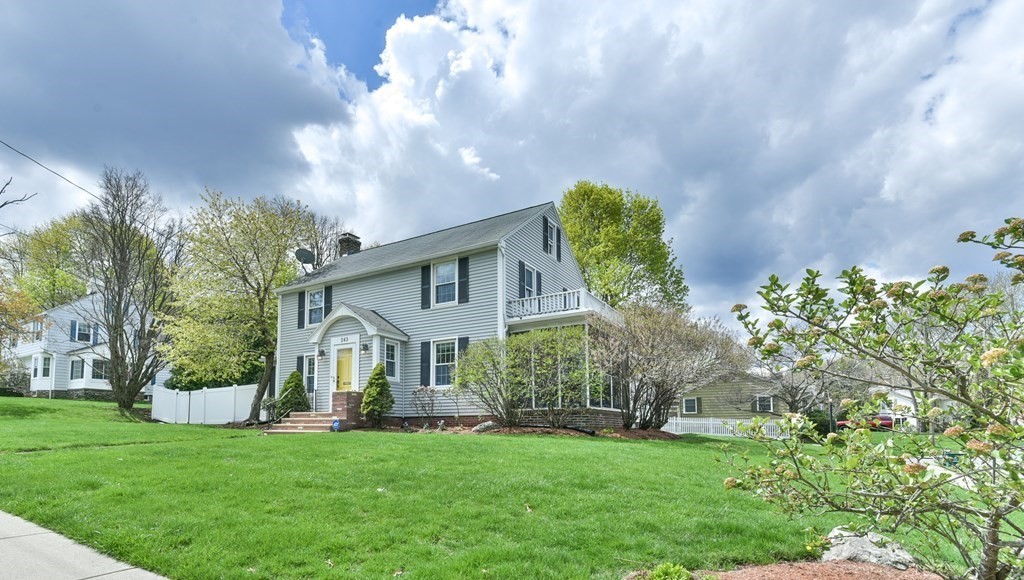 243 Beverly Road Worcester, MA 01605 - Photo 1 of 41 a view of a house with a big yard potted plants and large tree