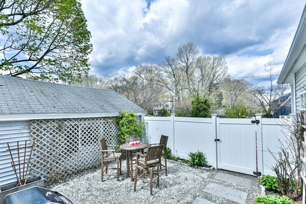 243 Beverly Road Worcester, MA 01605 - Photo 15 of 41 a backyard of a house with table and chairs