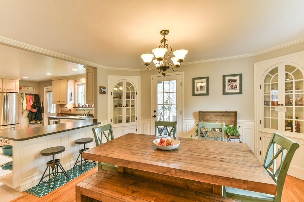 243 Beverly Road Worcester, MA 01605 - Photo 20 of 41 a view of a dining room with furniture a chandelier and wooden floor