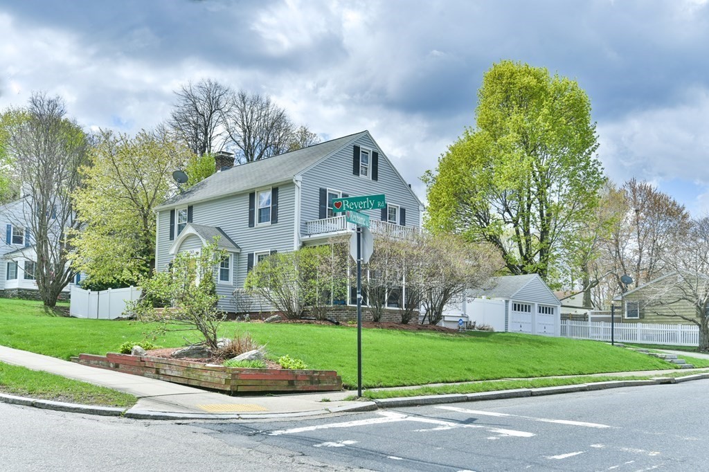 243 Beverly Road Worcester, MA 01605 - Photo 2 of 41 a front view of a house with a yard and garage