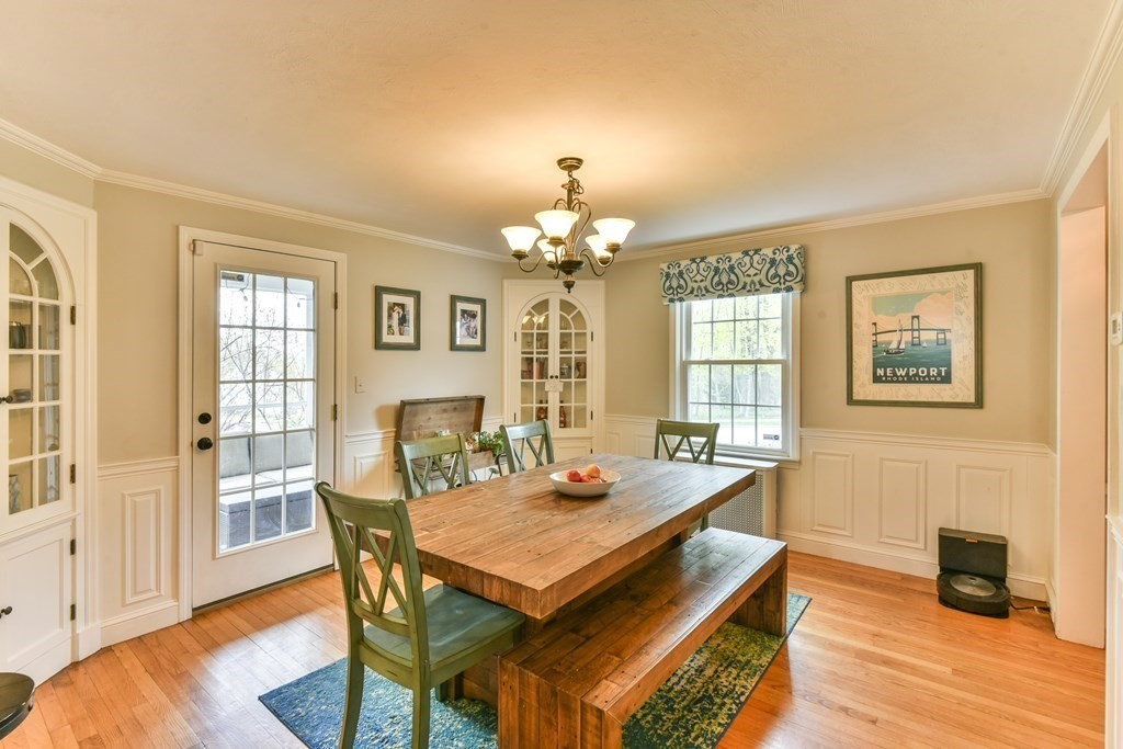 243 Beverly Road Worcester, MA 01605 - Photo 21 of 41 a dining room with wooden floor and chandelier