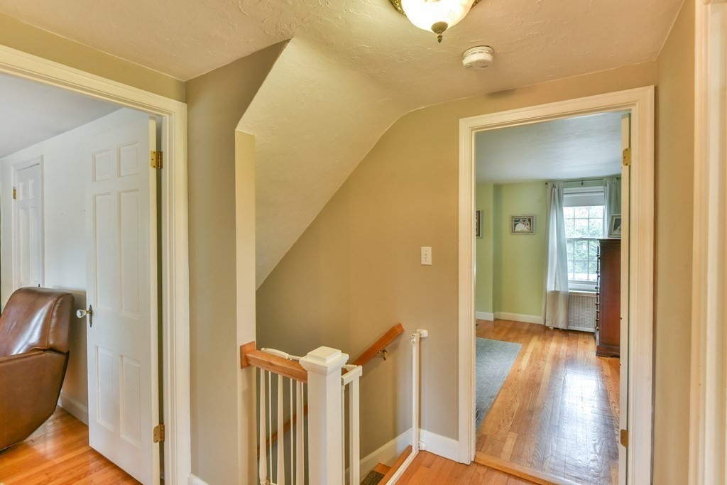 243 Beverly Road Worcester, MA 01605 - Photo 34 of 41 a view of a hallway with wooden floor and staircase