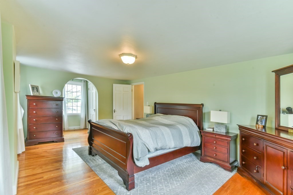 243 Beverly Road Worcester, MA 01605 - Photo 36 of 41 a bedroom with a bed and wooden floor