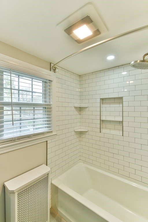 243 Beverly Road Worcester, MA 01605 - Photo 40 of 41 a bathroom with a bathtub and a shower
