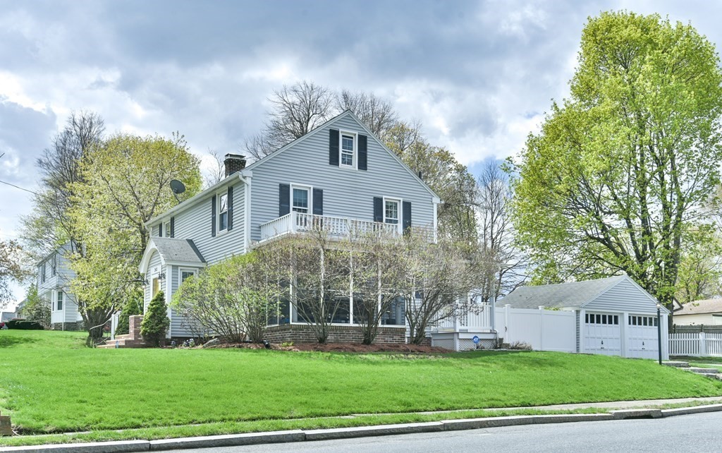 243 Beverly Road Worcester, MA 01605 - Photo 6 of 41 a front view of a house with a yard